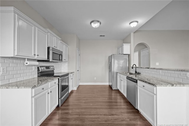 254 Blackhawk Ln, Raeford, NC 28376 - kitchen featuring appliances with stainless steel finishes, a sink, backsplash, and white cabinets