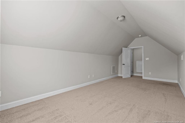 254 Blackhawk Ln, Raeford, NC 28376 - bonus room with vaulted ceiling, light carpet, and baseboards