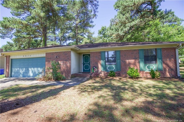 6874 Fern Creek Pl, Fayetteville, NC 28314 - ranch-style home with brick siding, an attached garage, concrete driveway, and a front lawn