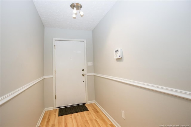 6874 Fern Creek Pl, Fayetteville, NC 28314 - doorway to outside featuring wood finished floors and baseboards