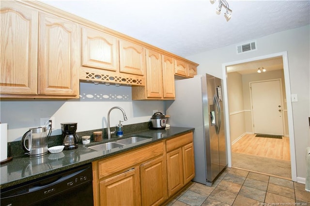 6874 Fern Creek Pl, Fayetteville, NC 28314 - kitchen with a sink, black dishwasher, stainless steel refrigerator with ice dispenser, and dark stone countertops
