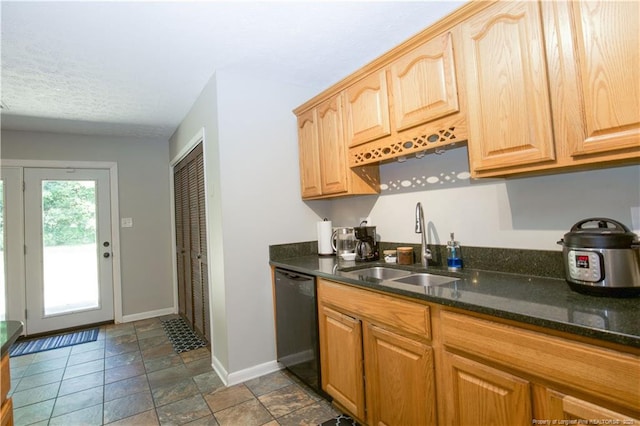 6874 Fern Creek Pl, Fayetteville, NC 28314 - kitchen featuring black dishwasher, a sink, baseboards, dark stone counters, and light brown cabinets