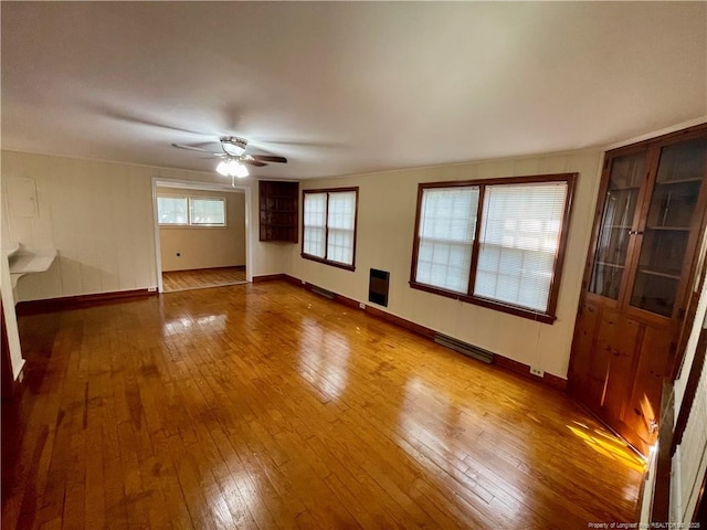 1007 Jenkins St, Lumberton, NC 28358 - empty room with hardwood / wood-style floors, a ceiling fan, and baseboards
