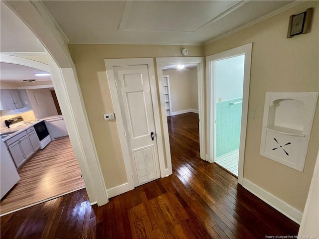 1007 Jenkins St, Lumberton, NC 28358 - hall with hardwood / wood-style flooring, arched walkways, baseboards, and ornamental molding