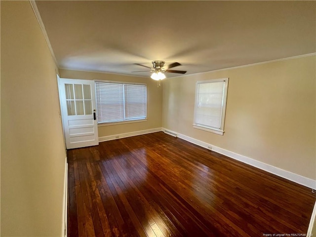 1007 Jenkins St, Lumberton, NC 28358 - unfurnished room featuring ornamental molding, dark wood-style flooring, baseboards, a ceiling fan, and healthy amount of natural light
