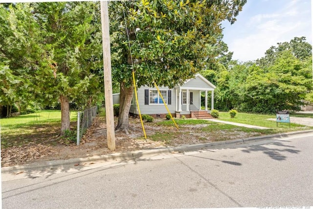 1007 Jenkins St, Lumberton, NC 28358 - view of property hidden behind natural elements featuring a porch and crawl space