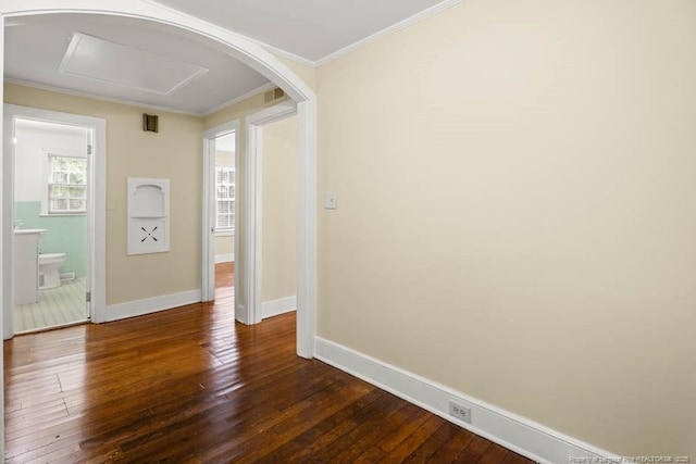 1007 Jenkins St, Lumberton, NC 28358 - empty room featuring dark wood finished floors, ornamental molding, and arched walkways