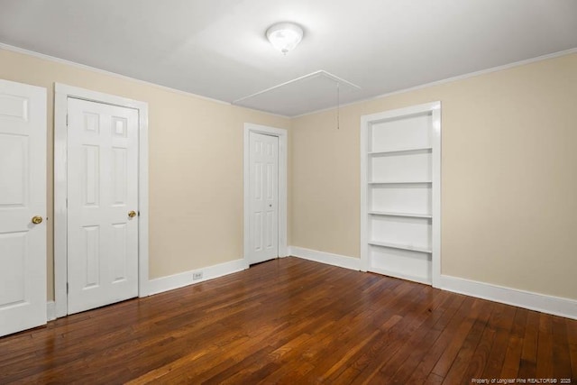 1007 Jenkins St, Lumberton, NC 28358 - unfurnished bedroom featuring attic access, hardwood / wood-style floors, and ornamental molding