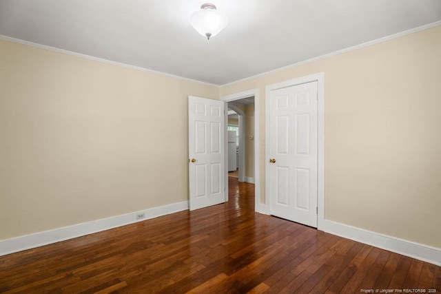 1007 Jenkins St, Lumberton, NC 28358 - unfurnished bedroom with dark wood-type flooring and ornamental molding