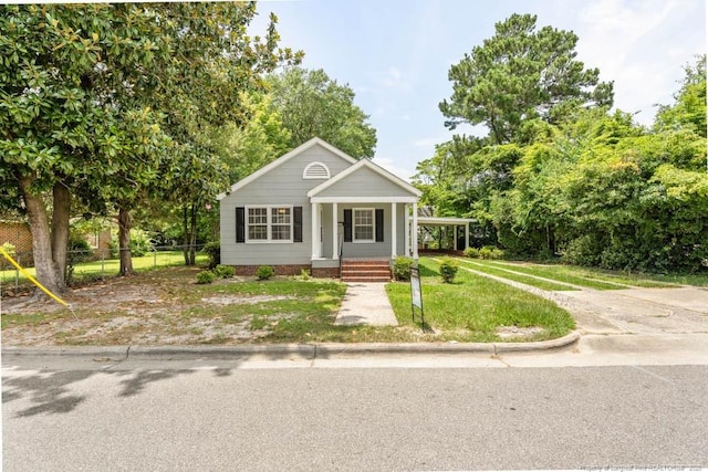 1007 Jenkins St, Lumberton, NC 28358 - view of front of property with a porch and view of scattered trees