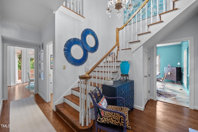 441 Fieldstone Dr, Burlington, NC 27215 - entrance foyer with crown molding, wood finished floors, baseboards, stairway, and a towering ceiling