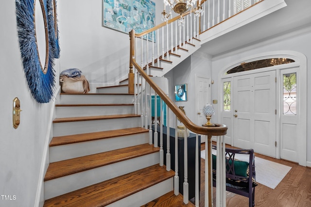 441 Fieldstone Dr, Burlington, NC 27215 - foyer entrance with healthy amount of natural light, stairs, wood finished floors, and a chandelier