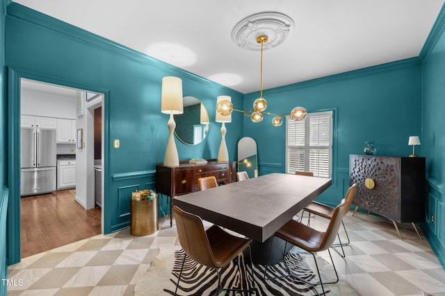 441 Fieldstone Dr, Burlington, NC 27215 - dining room featuring crown molding, wainscoting, light flooring, and a decorative wall