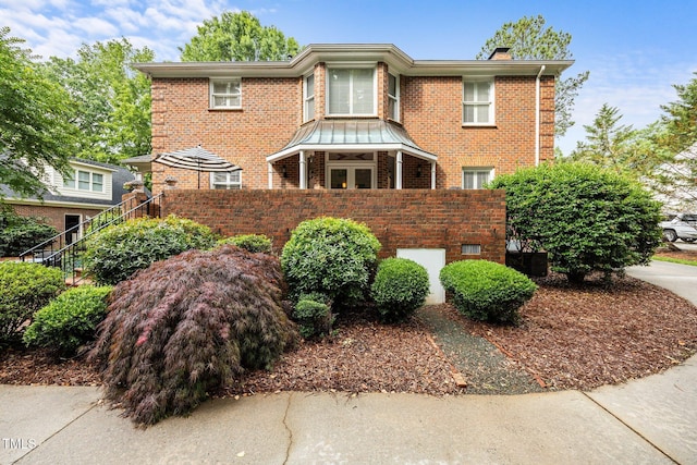 441 Fieldstone Dr, Burlington, NC 27215 - view of front facade with brick siding and a chimney