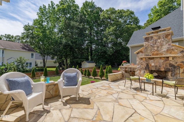 8913 Walking Stick Trl, Raleigh, NC 27615 - view of patio featuring an outdoor stone fireplace