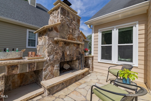 8913 Walking Stick Trl, Raleigh, NC 27615 - view of patio featuring an outdoor stone fireplace