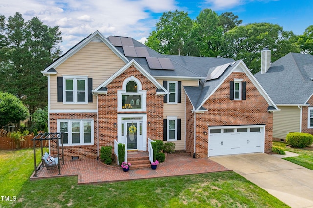 8913 Walking Stick Trl, Raleigh, NC 27615 - traditional home featuring brick siding, solar panels, and concrete driveway