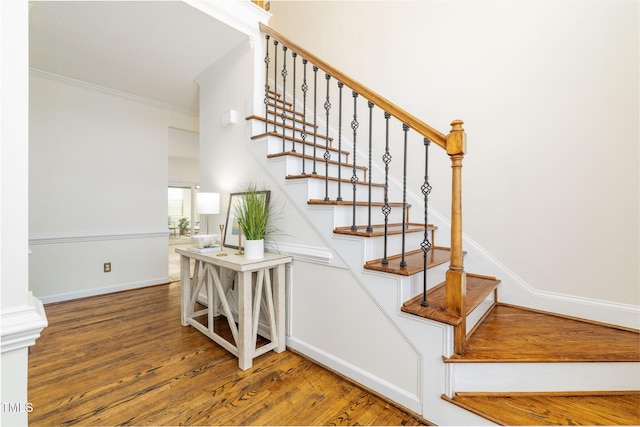8913 Walking Stick Trl, Raleigh, NC 27615 - stairway featuring wood finished floors, crown molding, and baseboards
