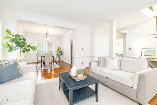 8913 Walking Stick Trl, Raleigh, NC 27615 - living area with light wood-style flooring, ornamental molding, and baseboards