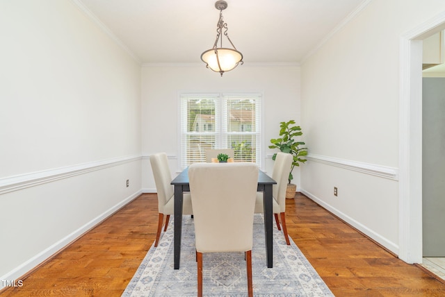 8913 Walking Stick Trl, Raleigh, NC 27615 - dining area featuring crown molding, wood finished floors, and baseboards