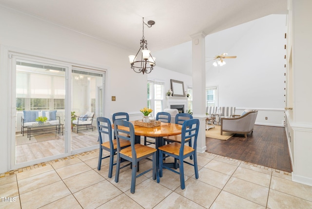 8913 Walking Stick Trl, Raleigh, NC 27615 - dining room with light tile patterned floors, ceiling fan, a fireplace, and ornamental molding