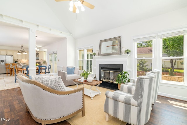 8913 Walking Stick Trl, Raleigh, NC 27615 - living room with a fireplace with flush hearth, ceiling fan, wood finished floors, and high vaulted ceiling