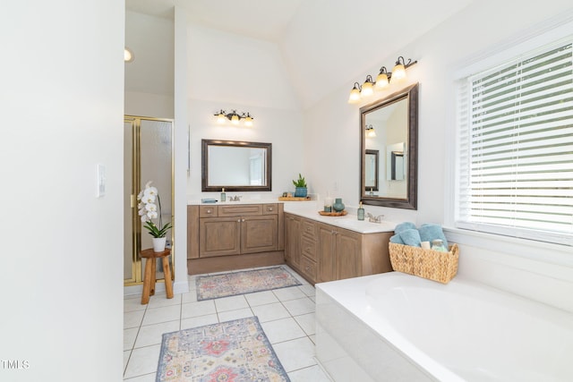 8913 Walking Stick Trl, Raleigh, NC 27615 - full bath with a stall shower, double vanity, a bath, and tile patterned floors