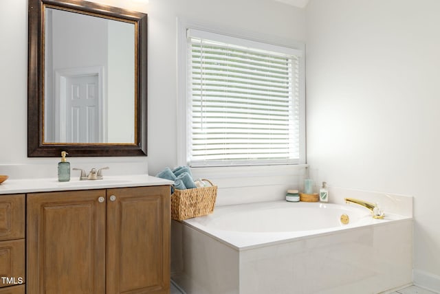 8913 Walking Stick Trl, Raleigh, NC 27615 - bathroom with vanity, plenty of natural light, and a garden tub
