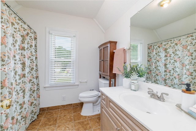 8913 Walking Stick Trl, Raleigh, NC 27615 - full bathroom with vanity, vaulted ceiling, toilet, and a shower with shower curtain
