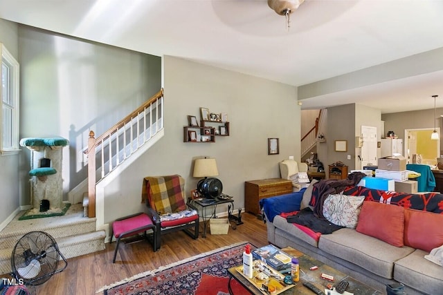 10205 Sorrills Creek Ln, Raleigh, NC 27614 - living area with stairs, wood finished floors, and baseboards