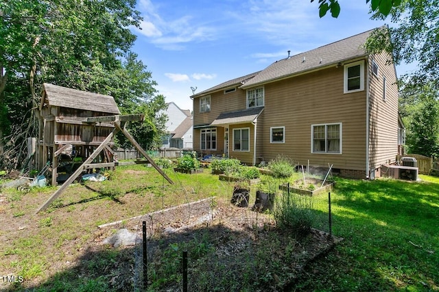 10205 Sorrills Creek Ln, Raleigh, NC 27614 - back of property featuring a vegetable garden and a yard