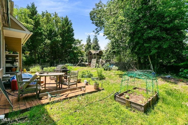 10205 Sorrills Creek Ln, Raleigh, NC 27614 - view of yard featuring a vegetable garden, view of wooded area, and outdoor dining area