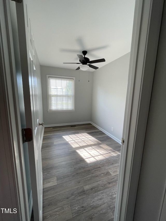 305 Briarcliff Dr, Dunn, NC 28334 - unfurnished room featuring a ceiling fan, baseboards, and dark wood-style flooring