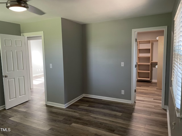 305 Briarcliff Dr, Dunn, NC 28334 - unfurnished room with dark wood-type flooring, baseboards, and a ceiling fan