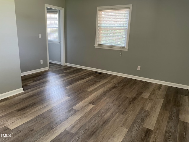 305 Briarcliff Dr, Dunn, NC 28334 - unfurnished room featuring baseboards and dark wood-type flooring