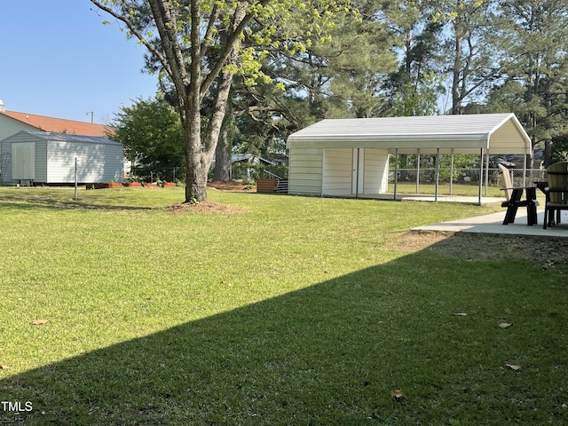305 Briarcliff Dr, Dunn, NC 28334 - view of grassy yard featuring a detached carport