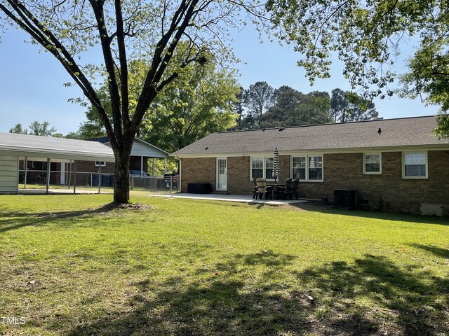 305 Briarcliff Dr, Dunn, NC 28334 - rear view of property featuring a patio area, brick siding, crawl space, and central air condition unit