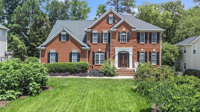 112 Sterling Ridge Way, Cary, NC 27519 - colonial home with brick siding and a front yard
