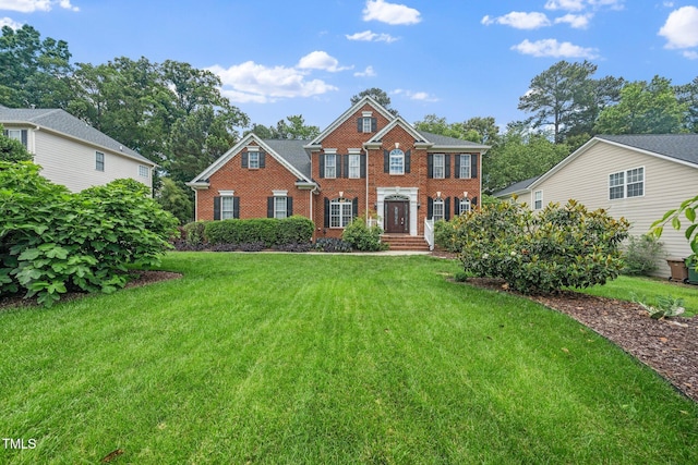 112 Sterling Ridge Way, Cary, NC 27519 - view of front of property with brick siding and a front yard