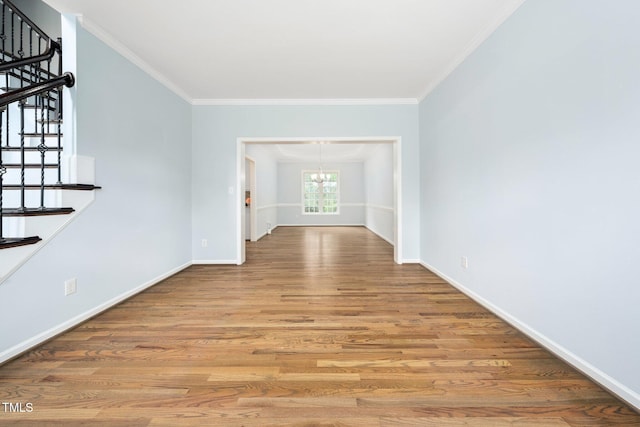 112 Sterling Ridge Way, Cary, NC 27519 - unfurnished room featuring a chandelier, stairs, ornamental molding, wood finished floors, and baseboards