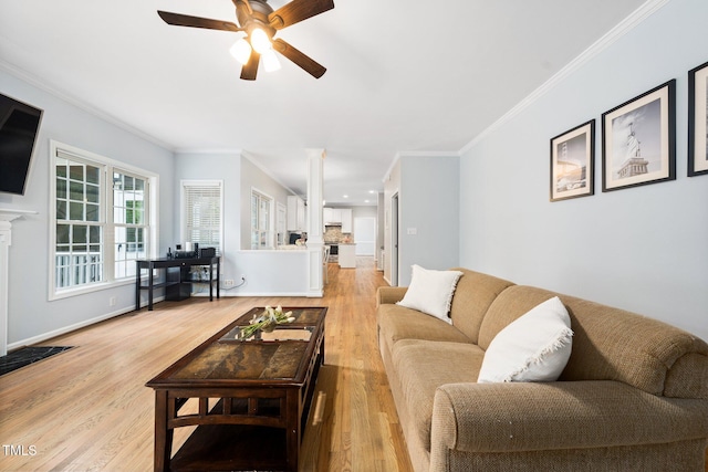 112 Sterling Ridge Way, Cary, NC 27519 - living room with a ceiling fan, wood finished floors, ornamental molding, a fireplace with flush hearth, and baseboards