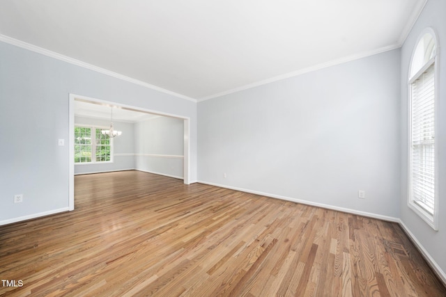 112 Sterling Ridge Way, Cary, NC 27519 - unfurnished room with a chandelier, wood finished floors, ornamental molding, and baseboards