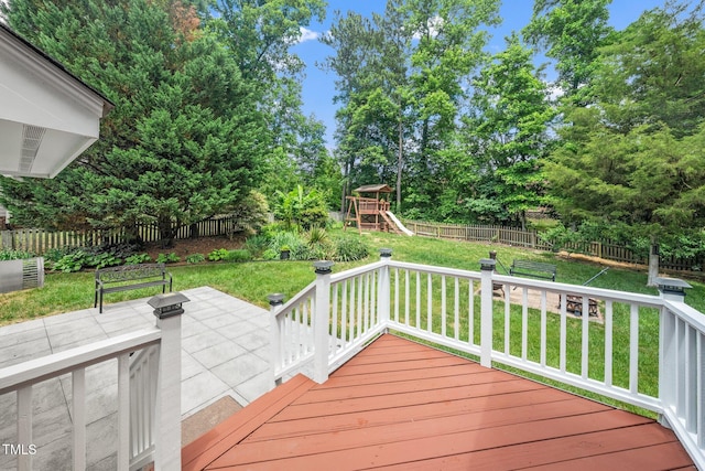 112 Sterling Ridge Way, Cary, NC 27519 - wooden deck with a playground and view of wooded area