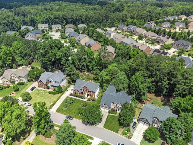112 Sterling Ridge Way, Cary, NC 27519 - aerial overview of property's location with nearby suburban area and a heavily wooded area
