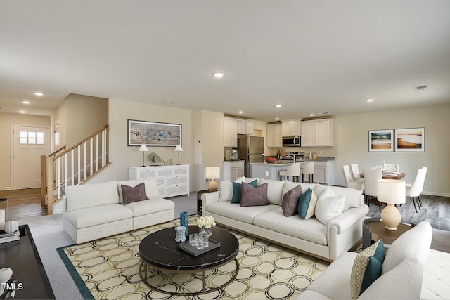 2700 Barrington Dr, Raleigh, NC 27610 - living room with stairway, baseboards, and recessed lighting