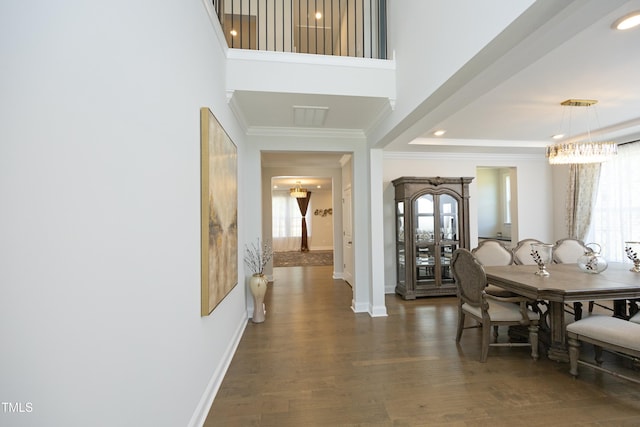 609 Ramsours Mill Dr, Holly Springs, NC 27540 - dining room with crown molding, a chandelier, baseboards, wood finished floors, and recessed lighting