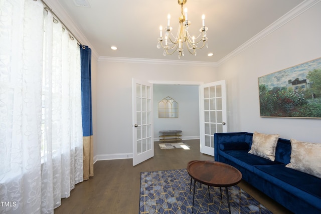 609 Ramsours Mill Dr, Holly Springs, NC 27540 - living area with french doors, wood finished floors, a chandelier, crown molding, and baseboards