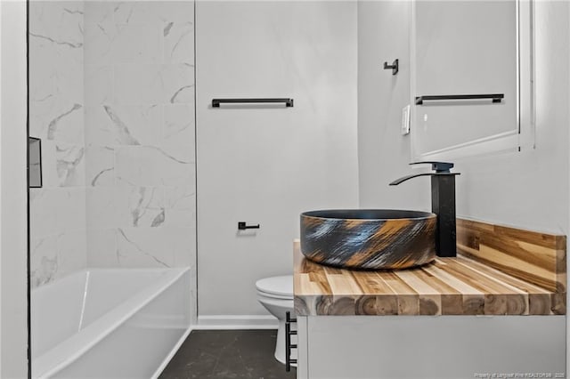 3902 Hartwell Rd, Fayetteville, NC 28304 - bathroom featuring baseboards, toilet, vanity, and shower / washtub combination