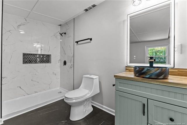 3902 Hartwell Rd, Fayetteville, NC 28304 - bathroom featuring toilet, vanity, a marble finish shower, and baseboards