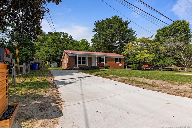 3902 Hartwell Rd, Fayetteville, NC 28304 - view of front facade with concrete driveway and brick siding